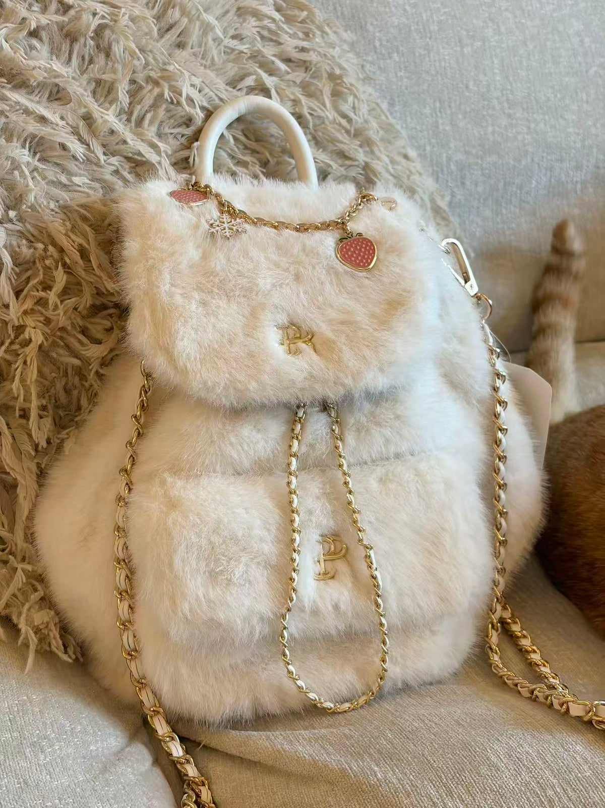 PSN Cream White Faux Fur Backpack – Gold Chain & Charm Detail