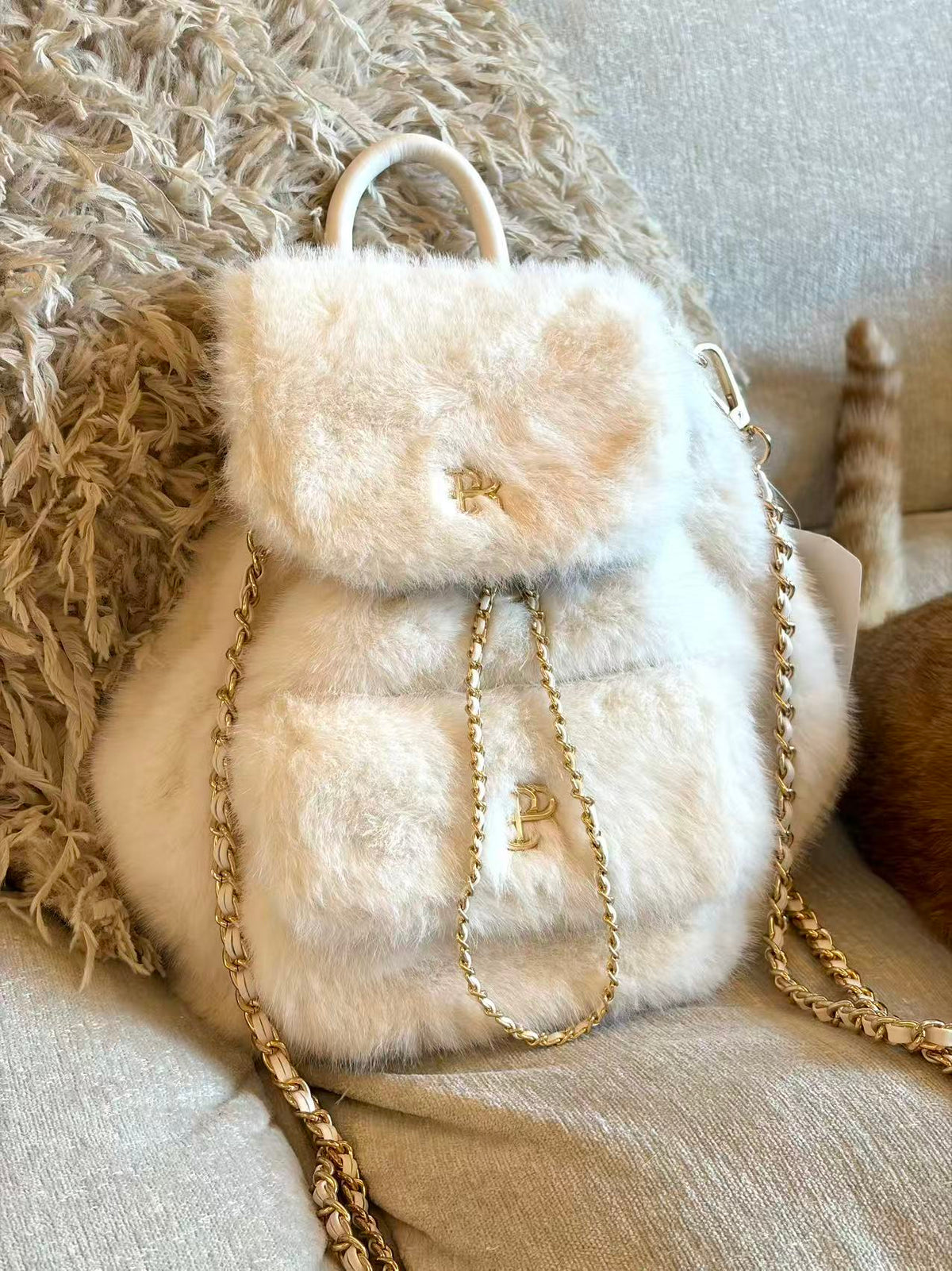 PSN Cream White Faux Fur Backpack – Gold Chain & Charm Detail